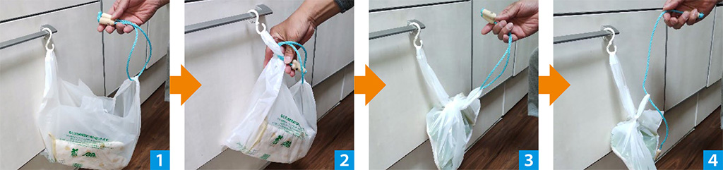 エレベーター前でボタンを押す様子